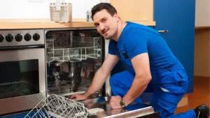 Orlando dishwasher repair technician inspecting a built-in dishwasher in a residential kitchen
