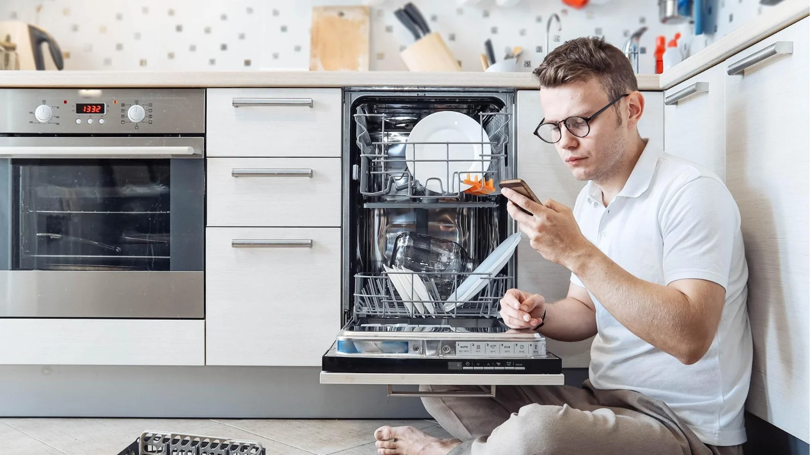 Homeowner troubleshooting dishwasher problems before calling for professional Orlando dishwasher repair